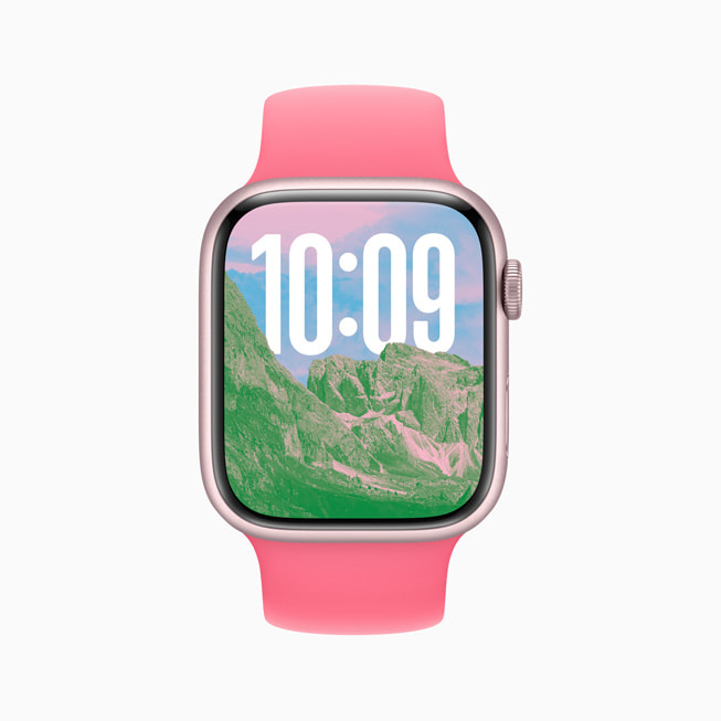 Une Apple Watch Series 9 avec un cadran Photos affichant l’image de montagnes escarpées.