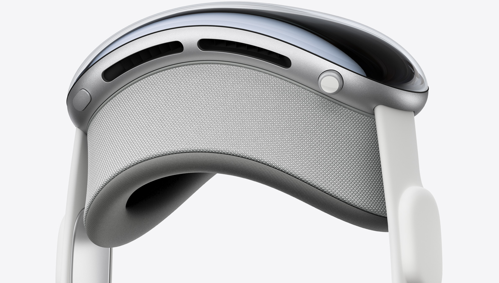 Vertical side view of Apple Vision Pro showing top button, Digital Crown, Light Seal and audio straps