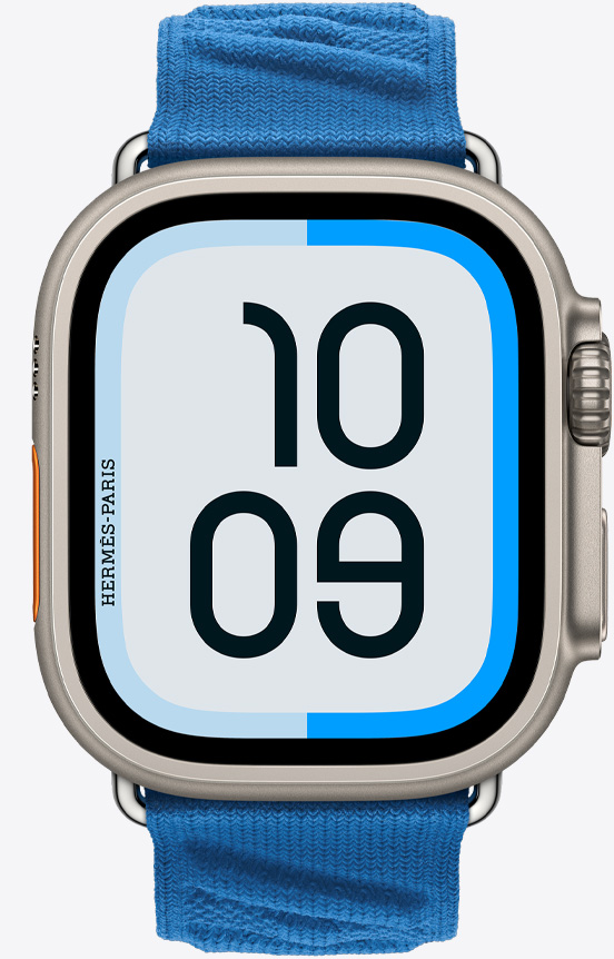 Front view of the Apple Watch Hermès Ultra 2 showing the Maritime watch face and new En Mer strap in Bleu Hydra (marine blue).